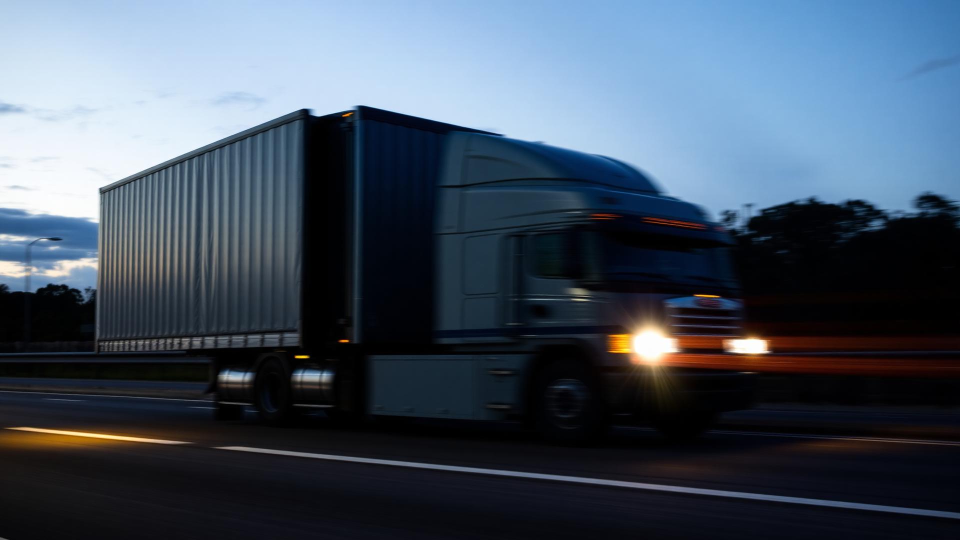 Freight truck on Australian highway at dusk
